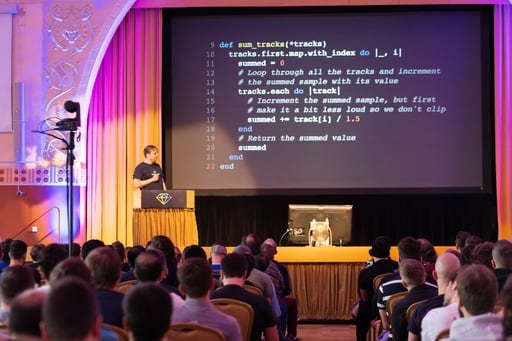 Thijs shows Ruby code, view from the back of the hall