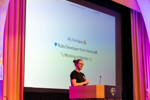 Lightning talk. Hi, I'm Hans. Ruby developer from Vienna. Working at Meister.’ on screen