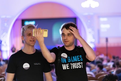 Two men taking a selfie in the congress hall